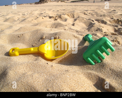 Child's plastic toys on beach Stock Photo