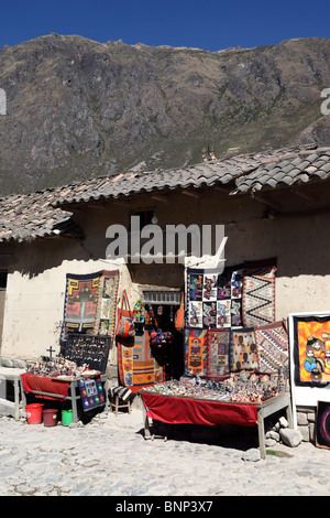 Souvenirs for sale outside rustic shop in village of Ollantaytambo , Sacred Valley , Peru Stock Photo