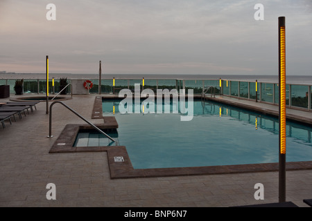 Pool overlooking the Coconut Grove harbor with Yacht club and Biscayne Bay Stock Photo