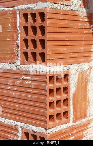 brick corner edge red construction clay bricks hollow airbrick Stock Photo