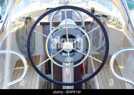 boat rudder wheel white sailboat detail beautiful yacht Stock Photo