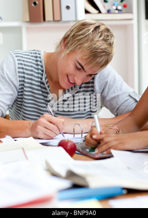 Teen guy studying in the library Stock Photo