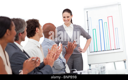 Cheerful business people clapping a good presentation Stock Photo