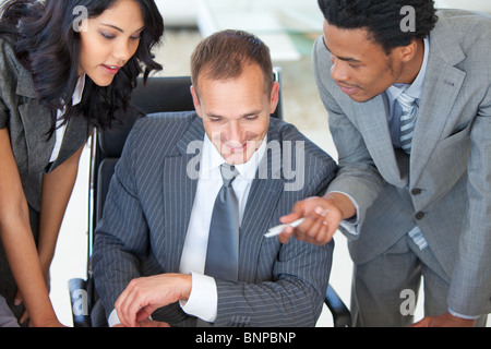 Manager with employees working in office Stock Photo