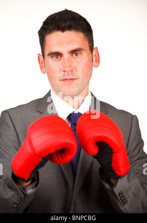 Serious businessman with boxing gloves Stock Photo