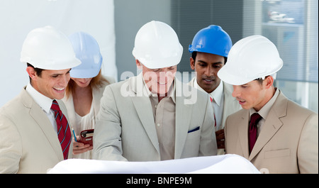 A group of architect discussing a construction plan Stock Photo
