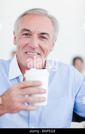 Senior businessman drinking a tea Stock Photo