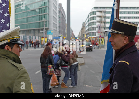 Actors dressed up as soldiers at Checkpoint Charlie, Berlin, Germany Stock Photo