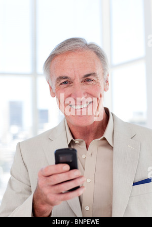Senior businessman using a mobile phone Stock Photo