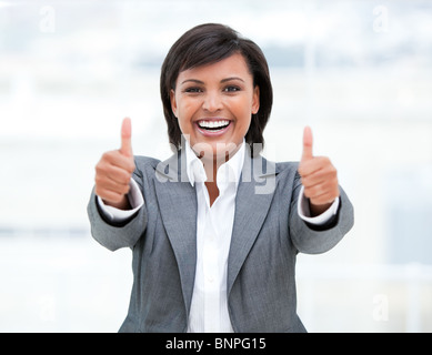 Portrait of a successful business woman with thumbs up Stock Photo