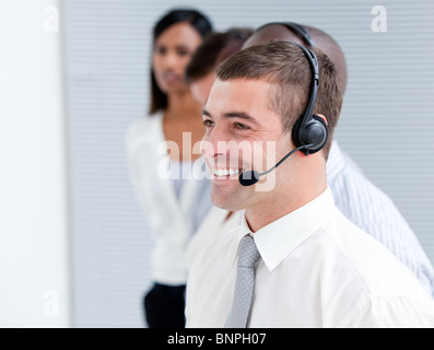 Confident customer service representatives standing in a line Stock Photo