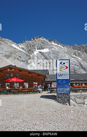 The Zugspitze Zugspitzplatt plateau with restaurants,  cogwheel and cable car station and view towards the summit Stock Photo
