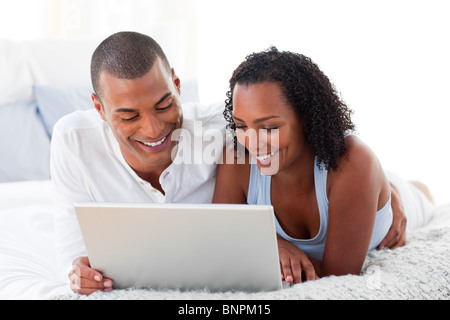 Affectionate couple using a laptop Stock Photo