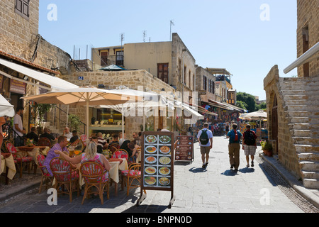 Cafe and shops on Plateia Evraion Martyron (Jewish or Martyrs Square) in the Old Town, Rhodes Town, Rhodes, Greece Stock Photo