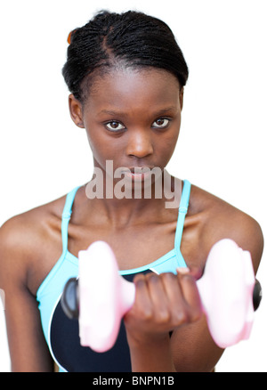 Attractive woman working out with dumbbell Stock Photo