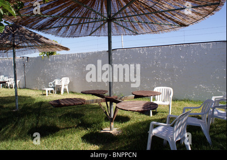 PICNIC TABLE AND PARASOL ON A GRASS PATIO IN  SPAIN ANDALUCIA