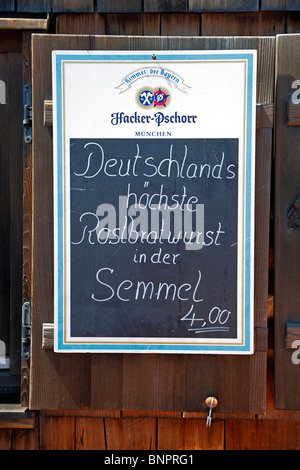 The  highest sausage in a roll on the menu on the summit of the highest mountain in Germany, the Zugspitze. Stock Photo
