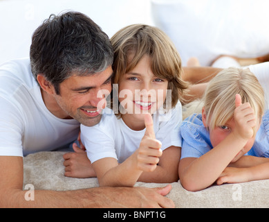 Affectionate father with his children having fun Stock Photo