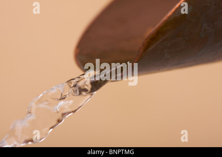 Custom Copper Faucet and Water Close-up. Stock Photo