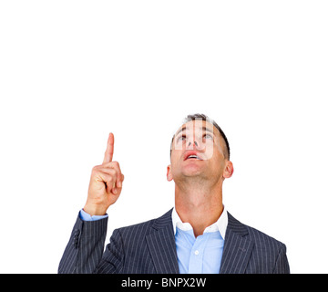 Surprised businessman pointing upward Stock Photo