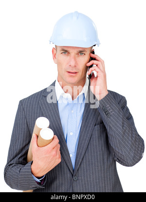 Stressed male engineer talking on phone Stock Photo