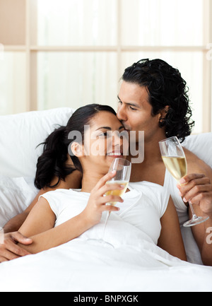 Man kissing his wife and drinking Champagne Stock Photo