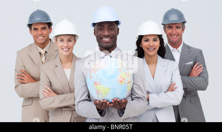 Architectural team holding a terrestrial globe Stock Photo