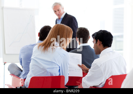 Two colleagues discussing together at a seminar Stock Photo