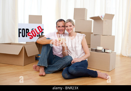 Cheerful couple toasting with Champagne Stock Photo
