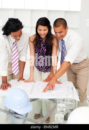International engineers discussing a construction plan Stock Photo