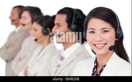 Confident business team with headset on standing in a row Stock Photo
