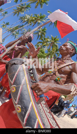 Papuan man drumming on Salawati Dance Stock Photo