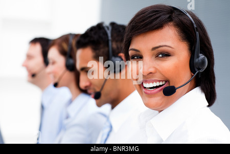 Attractive young woman working in a call center Stock Photo