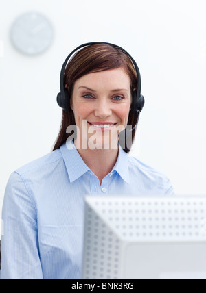 Customer service agent working in a call center Stock Photo