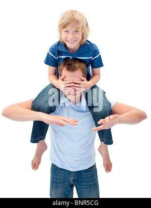 Joyful father giving his son piggyback ride Stock Photo