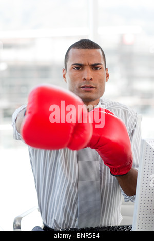 Super competitor businessman with boxing gloves Stock Photo