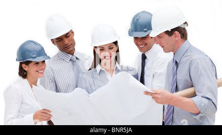Smiling architects studying a blueprint Stock Photo