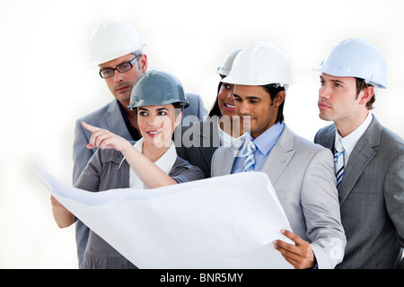A diverse group of architects studying a plan Stock Photo