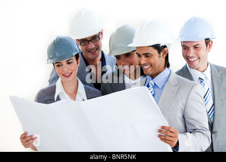Architects studying a blueprint Stock Photo