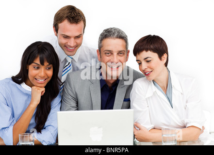 A diverse business group using a laptop Stock Photo