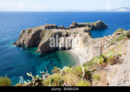 Headland Punta Milazzese of island Panarea of Aeolian Islands contain prehistory ruin site on the top. Stock Photo