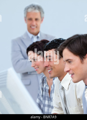 Serious business partners with their senior manager Stock Photo