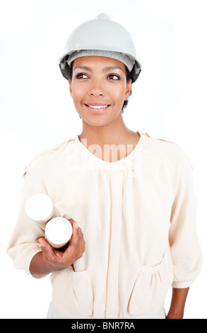 Female architect holding blueprints Stock Photo