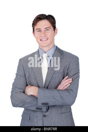 Self-assured businessman standing with folded arms Stock Photo