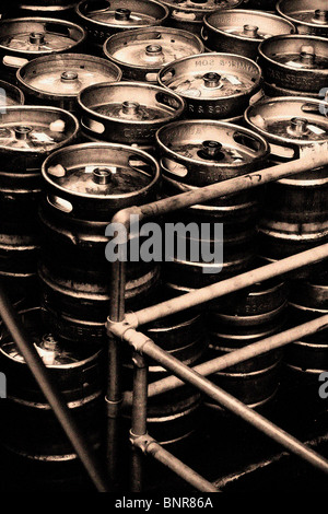 black & white, sepia tinted beer barrels stacked, Beer casks outside of a pub Stock Photo