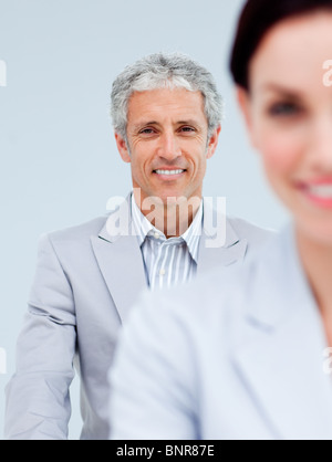 Mature businessman smiling at the camera Stock Photo