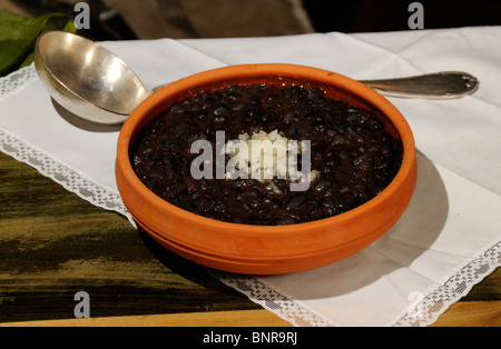 Typical cuban dish - balck beans - served on rustic bowl Stock Photo