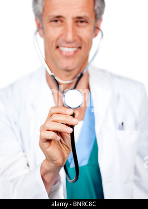 Attractive doctor presenting his stethoscope Stock Photo