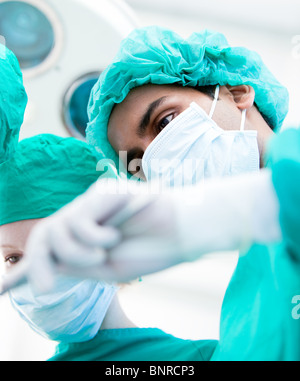 Serious surgeons during an operation. Medical concept. Stock Photo