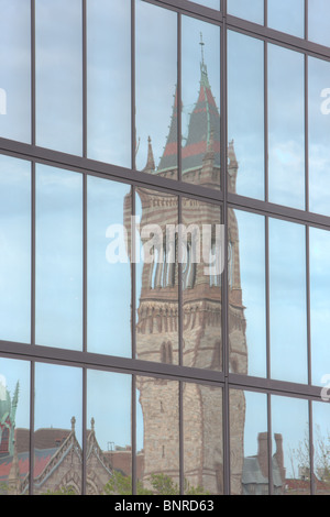 Boston's New Old South Church, located in Copley Square, reflected in the windows of the John Hancock building in Boston, Massachusetts. Stock Photo